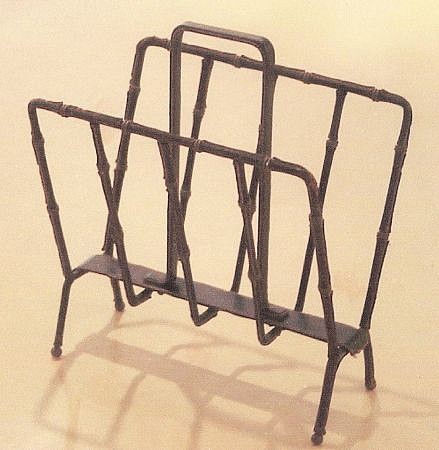 Jacques Adnet,  Magazine rack , 1950  iron covered with hand sewn black leather and cream stitching by Hermes, brass details, 19 1/2 x 17 x 11 inches