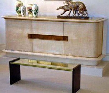 Jacques Adnet -&nbsp;Cabinet in Original Parchment, c. 1935 parchment colored lacquer and gilded glass top.  Giltz bronze lockplates and fittings.  Interior in Oak and original shelves. 34 x 86 x 20 1/2 inches ADN-004